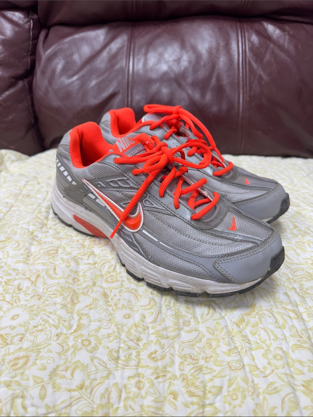 Nike Gray Sneakers with Bright Orange Accents
